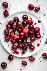 cherries on a white plate 