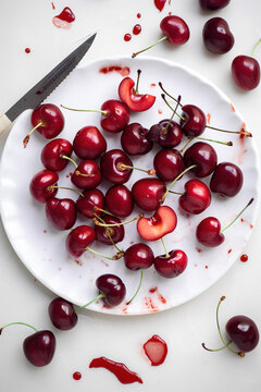cherries on a white plate 