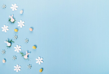 Festive Easter border, frame from easter eggs and spring flower crocus on blue background.