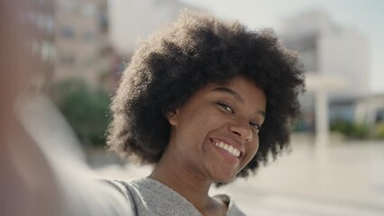 African american woman smiling confident making selfie by camera at street