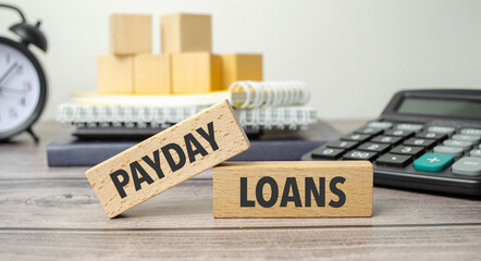 payday loans on the work table and alarm clock
