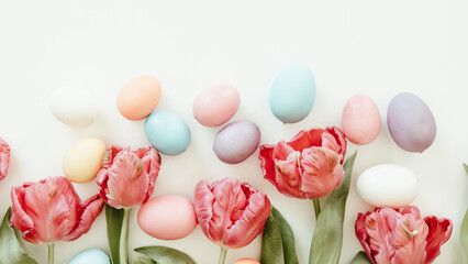 Tulips and easter eggs on a white background