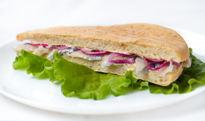 sandwich with lettuce and fish isolated on white background