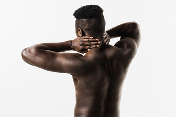Scoliosis is sideways curvature of the spine of muscular african american man. Rheumatism and arthritis diseases. Rachiocampsis bachache and neck pain of shirtless african man on white background. - obrazy, fototapety, plakaty