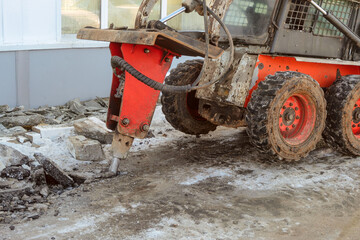 Hydraulic jack hammer destroy crushes frozen asphalt