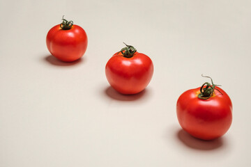 Red Tomatoes fresh organically grown on white background. Cool minimal flat lay, copy space