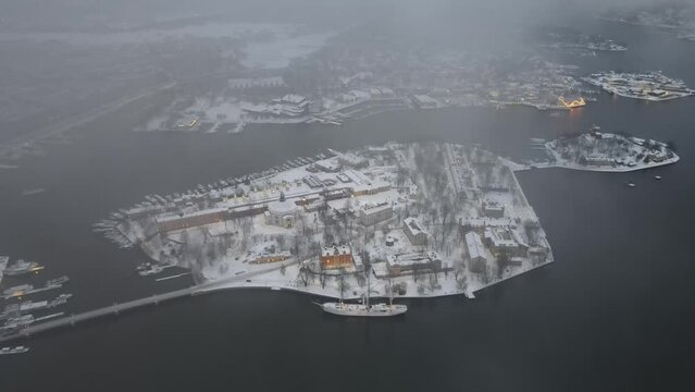 Aerial video of STF Af Chapman & Skeppsholmen Vandrarhem with a Persian ship in the background