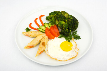 fried eggs with vegetables