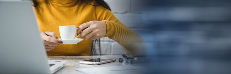 woman hand coffee in office table background