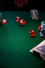dice chips on green cloth for poker