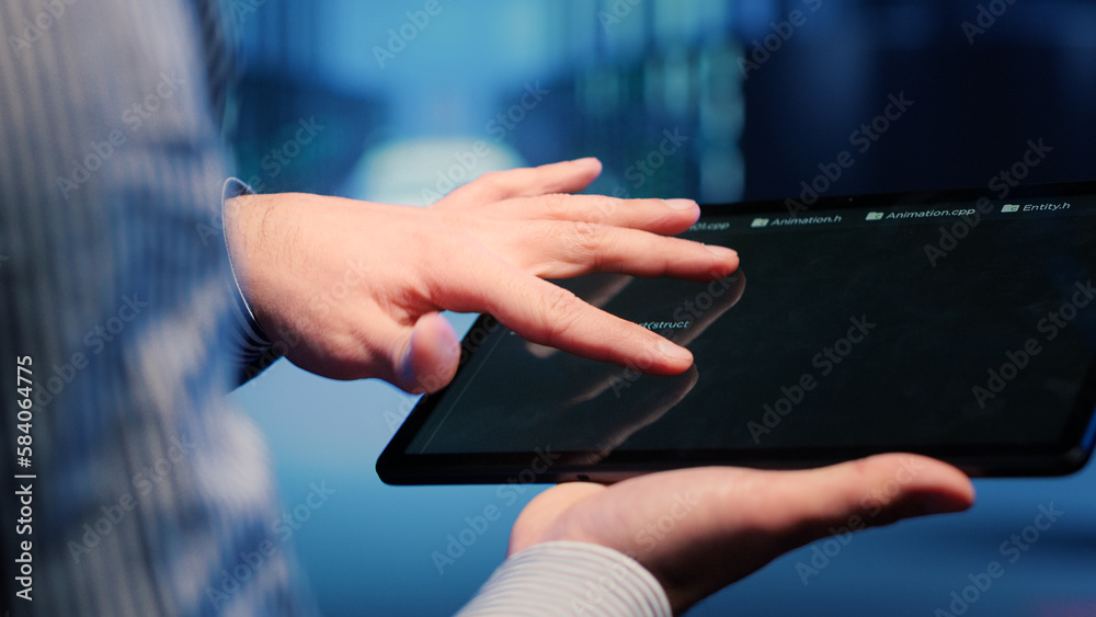 Poster male database technician looking at hosting server on tablet, working on cyberspace networking. infr