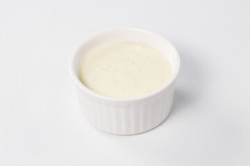 white sauce, mayonnaise on a white background