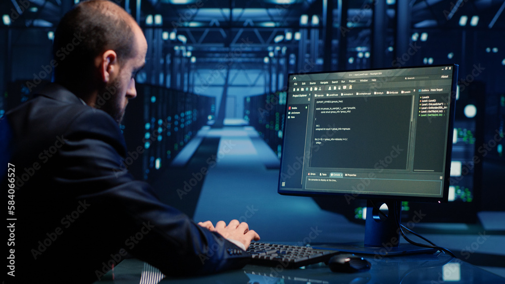 Poster male system engineer analyzing big data on computer, checking cloud computing network and digital se
