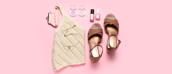 Stylish female look with leather shoes and knitted top on pink background