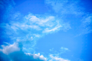 Fototapeta na wymiar Bright blue sky with big clouds backdrop