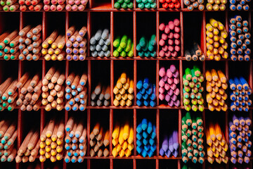colorful pencils are on the rack