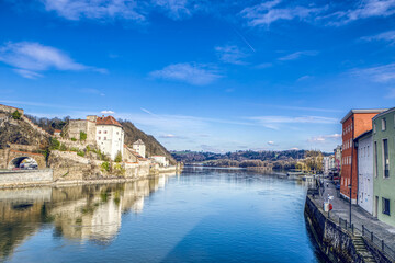 Fototapeta na wymiar High dynamic range cityscape view of Passau city with view at the river Danube and Veste Niederhaus in early spring in march