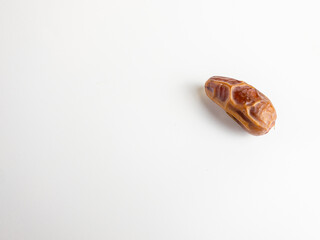 close up view of kurma, tunish dates isolated on white background