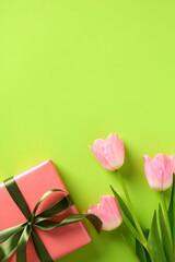 Happy Mother Day concept. Vertical banner design with tulips and gift box on green background.
