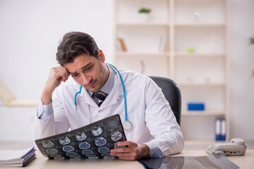 Young male doctor radiologist working in the clinic