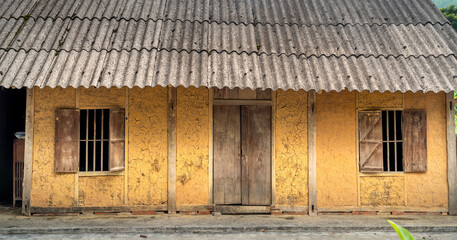 Fototapeta na wymiar The house made of mud, clay, wood, bamboo, and straws