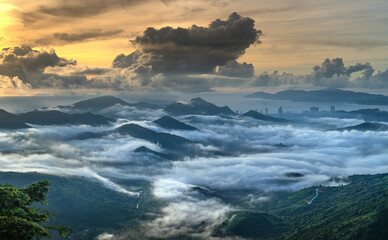 Panoramic view of Nha Trang coastal city at dawn, seen from the top of a high mountain in Vinh Phuong commune, Nha Trang City, Khanh Hoa province, Vietnam
