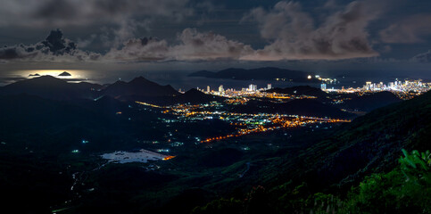 Panorama of the coastal city of Nha Trang with brilliant lights, seen from the top of a high mountain in Vinh Phuong commune, Nha Trang City, Khanh Hoa province, Vietnam