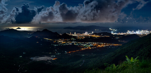 Panorama of the coastal city of Nha Trang with brilliant lights, seen from the top of a high mountain in Vinh Phuong commune, Nha Trang City, Khanh Hoa province, Vietnam