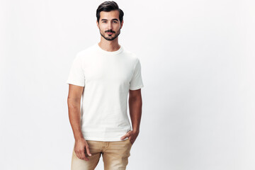 Male fashion model in a white t-shirt and jeans, smile with teeth joy on a white isolated...