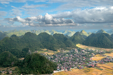Fototapeta na wymiar Panoramic view of Bac Son valley during the ripe rice season. View from the top of Na Lay mountain, Bac Son district, Lang Son province, Vietnam