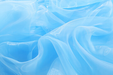 Obraz premium Beautiful light blue tulle fabric as background, closeup