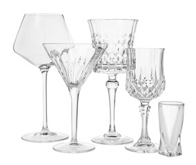 Different elegant empty glasses isolated on white