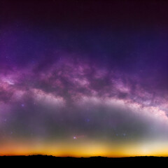 Fototapeta na wymiar View of the Milky Way at dusk, with accented shades of purple and yellow