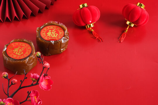 nian gao or chinese new year cake, dodol cina, kue bakul or kue keranjang in red bacground. CNY concept