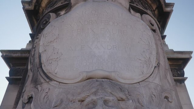 Inscription On A Pylon Under The Statue Of La France Sous Louis XIV In Front Of The Pont Alexandre III In Paris, France. - tilt up