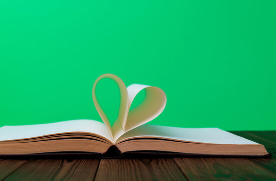 Book pages curved into heart shape