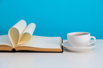 Book pages curved into heart shape