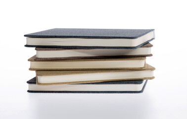 Stack of books on white background
