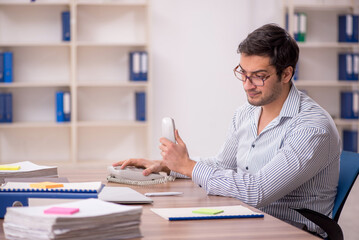 Young male employee working in the office