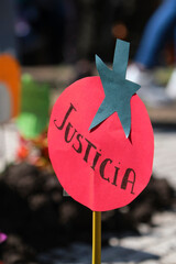 Paper figure of tomato with word justice, concept of sustainable agriculture