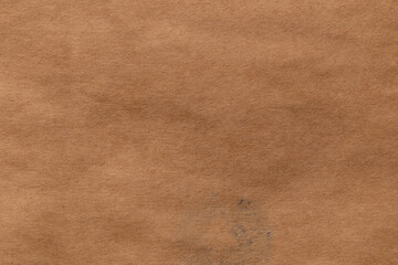 Brown color eco recycled kraft paper sheet texture cardboard background.