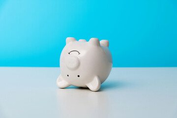 Piggy bank upside down on the table