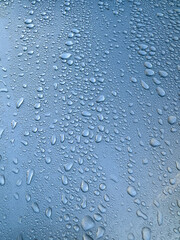 close up drops of water on a car