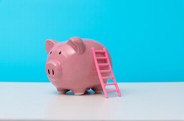 Piggy bank with a ladder
