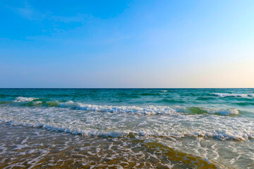 Beach with wave and blue sea water background