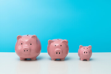 Three piggy banks on the table