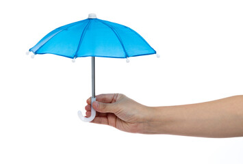 Human hand holding a small umbrella