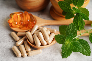 Alternative medicine herbal organic capsule with vitamin E omega 3 fish oil, mineral, drug with herbs leaf natural supplements for healthy good life.