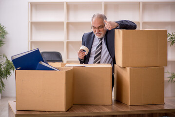 Old male employee in office relocation concept