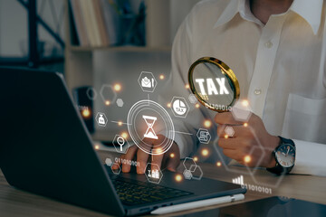A businessman hands are cradling a complete Individual income tax return form online for tax payment. Government, state taxes. Data analysis, paperwork, financial research, report.